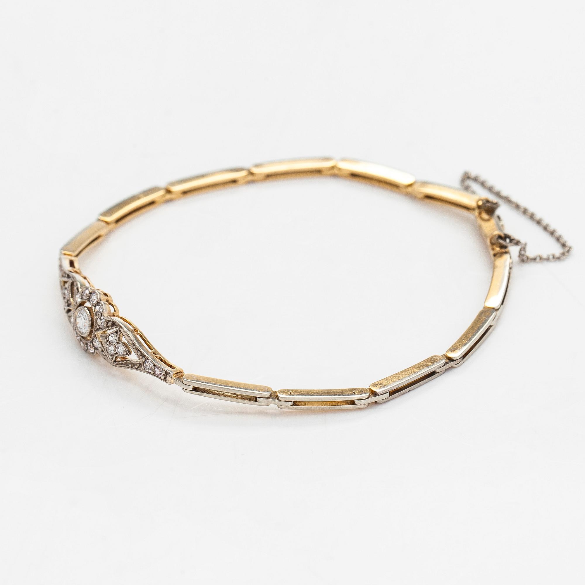 Rannekoru, 18K kultaa timantteja yhteensä noin 0.50 ct. Suomalaiset leimat.