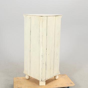 A painted 19th century corner cabinet.