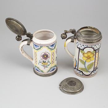Two pewter mounted faience tankards, Germany, 18th century..