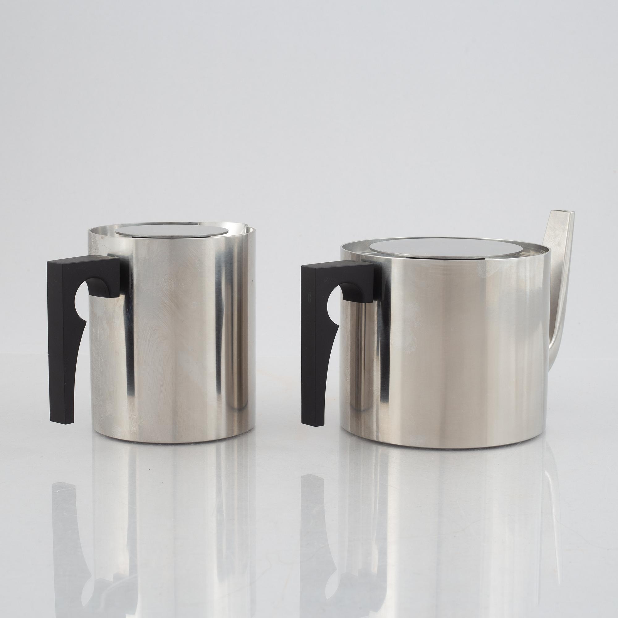 Arne Jacobsen, a 100-year jubilee "Cylinda" stainless steel tea set and a book, Stelton, Denmark, 2002.