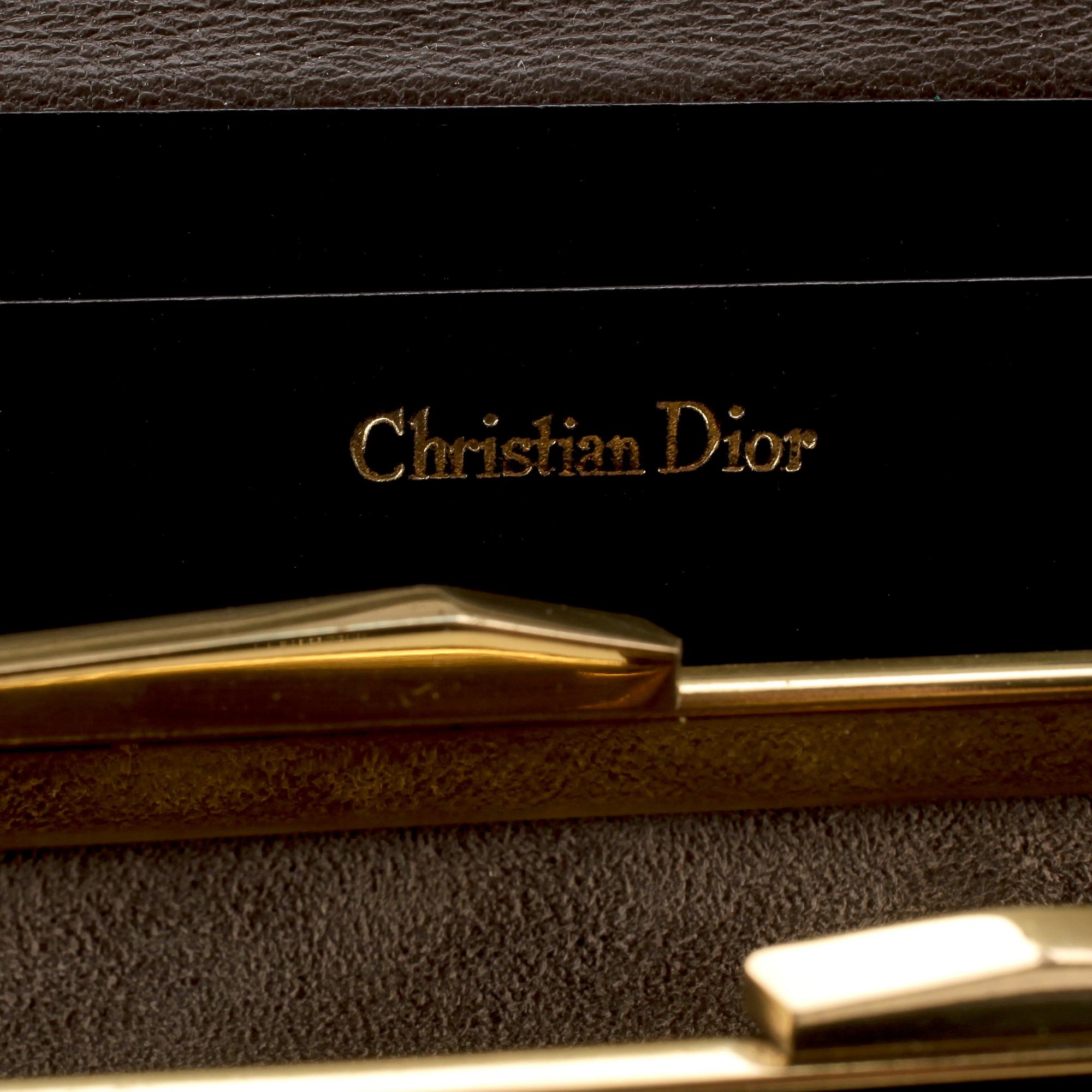 CHRISTIAN DIOR, a brown calf leather clutch / evening bag.