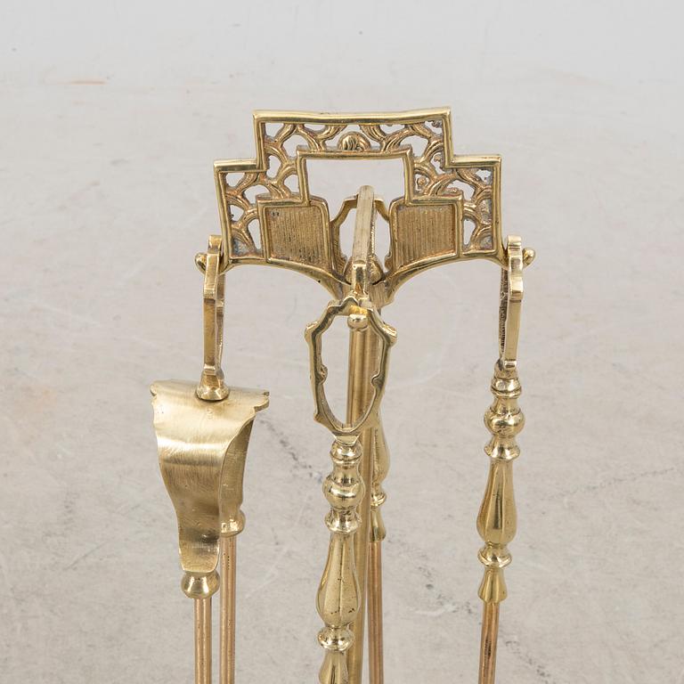 A late 20th century English brass fire tools.