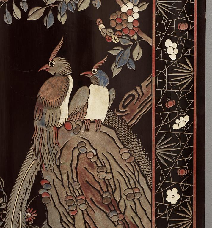 A coromandel black-lacquer four panel screen, Qing Dynasty (1644-1912).