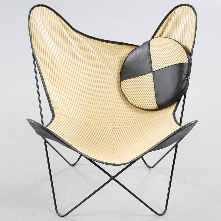 A chair, so called bat chair, made in the mid 20th century.