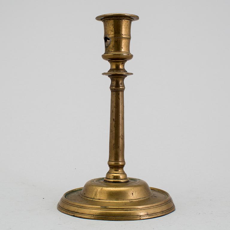 A 1500s bronze candlestick.