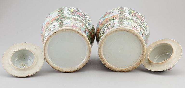 A pair of large canton famille rose vases with covers, Qing dynasty, late 19th century.