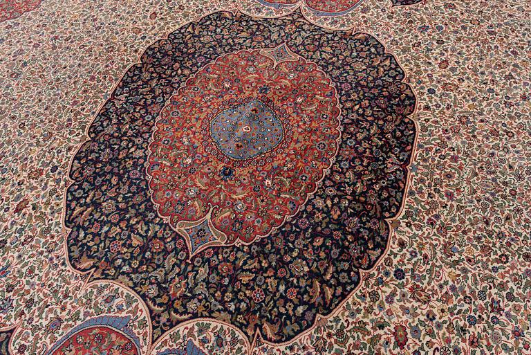 A semi-antique Hereke carpet, Western Turkey, c. 685 x 489 cm.