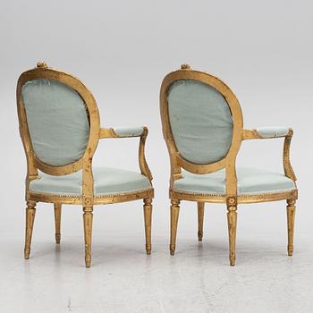 A sofa and a pair of chairs, Louis XVI style, circa 1900.