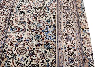 A Nain carpet, part silk, 9 laa, c. 318 x 209 cm.