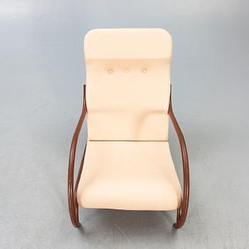 A 1930/40s metal and textile/plastic easy chair.