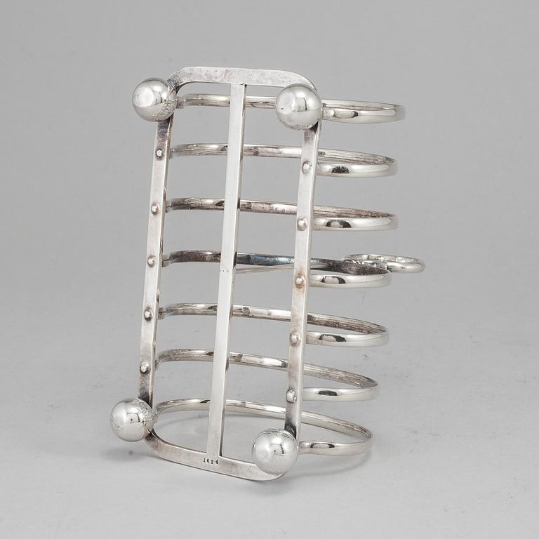 An English 20th century silver-plated toast rack, marked WH.
