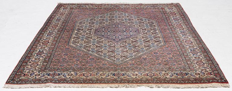 An oriental rug, approx. 238 x 174 cm.
