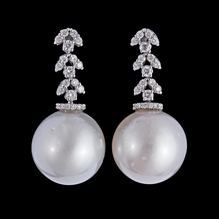 A pair of cultured South sea pearl, 16 mm, and brilliant cut diamonds, tot. app. 0.80 cts.