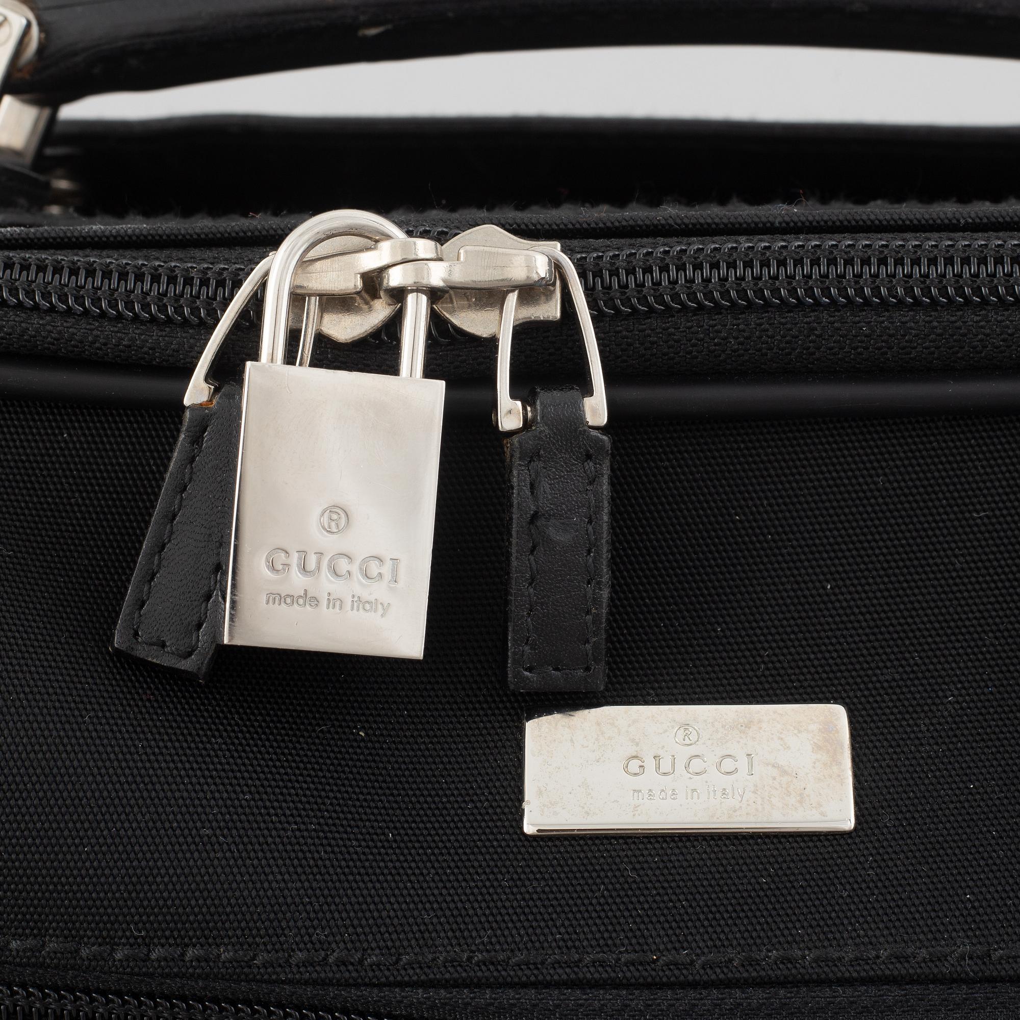 Gucci, suitcase/cabin bag.