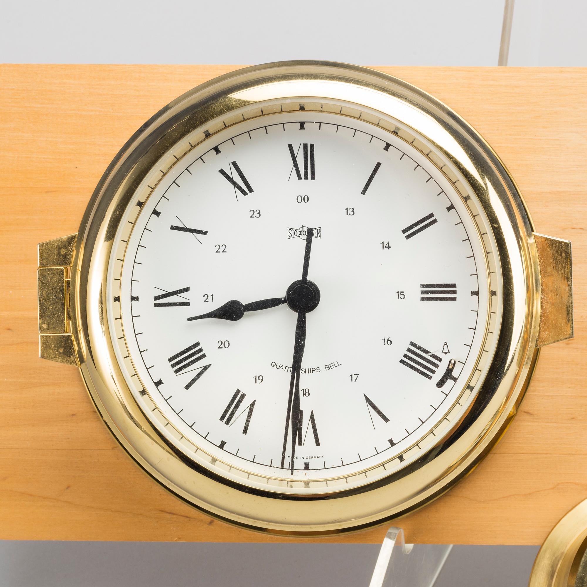 TWO BRASS MARINE CLOCK AND A BAROMETER BY STOCKBURGER.