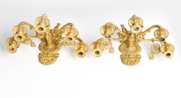 A pair of French Empire ormolu five-branch wall-lights, Paris, early 19th century.