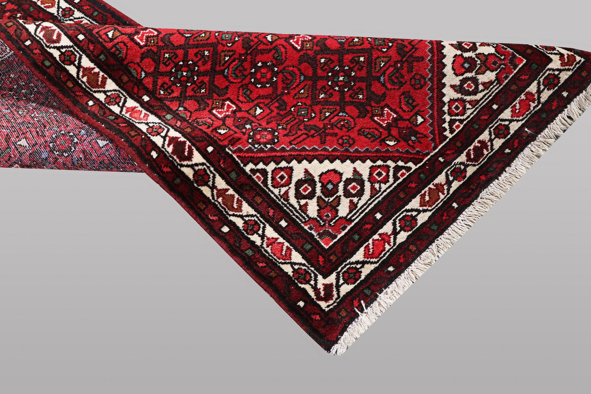 A runner carpet, Hosseinabad, ca 393 x 82 cm.