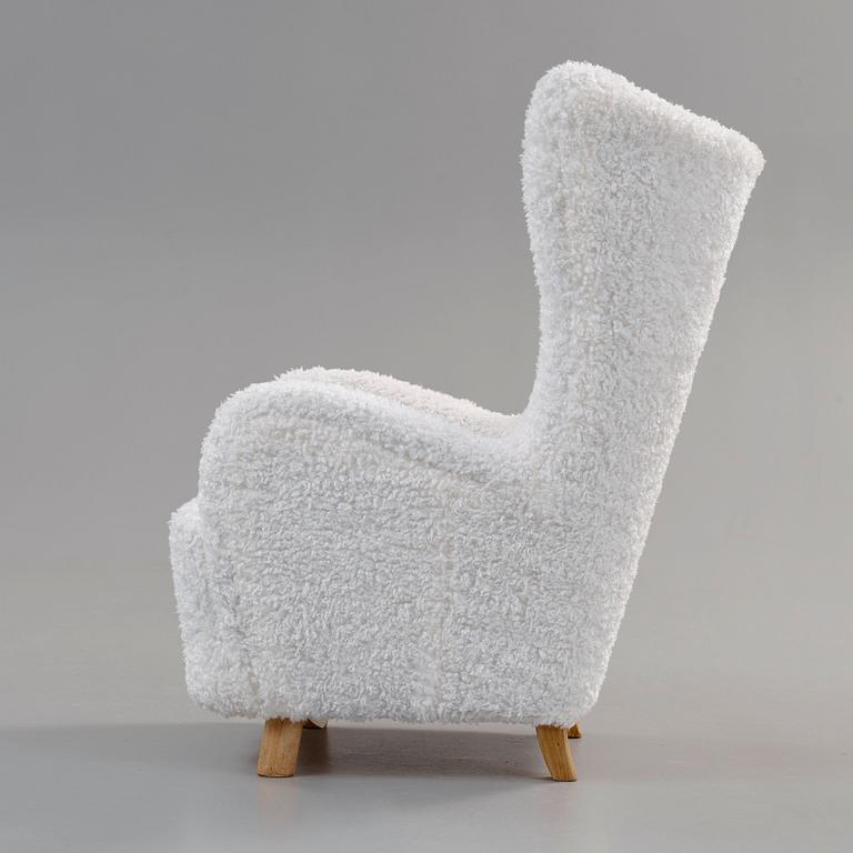 An upholstered easy chair, probably by Mogens Lassen, Denmark 1930's-40's.