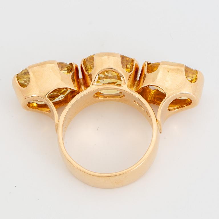 18K gold and yellow sapphire three-stone ring.