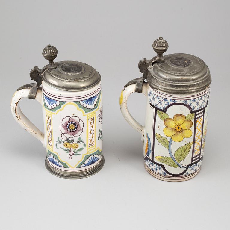 Two pewter mounted faience tankards, Germany, 18th century..