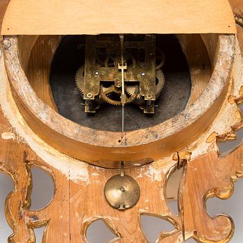 A Rococo style wall clock from first half of the 20th century.