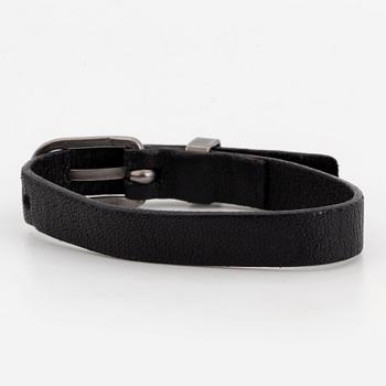 CHANEL, a leather bracelet.