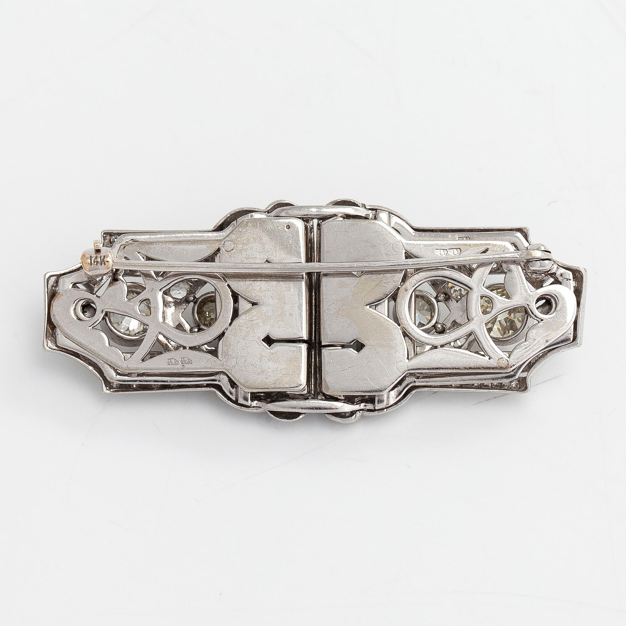 A 14K white gold Art Deco double clip brooch with old-cut diamonds approximately 4.90 cts in total. Austrian importmark.
