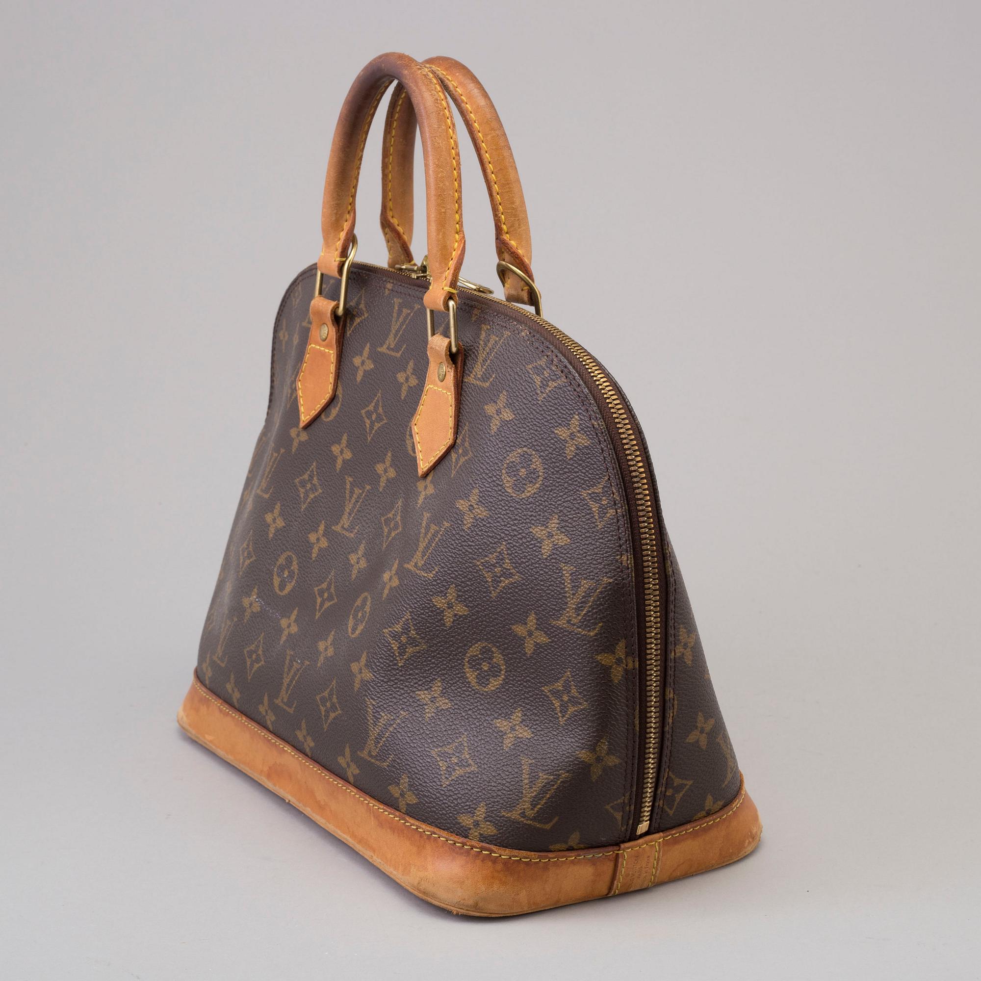 An 'Alma' handbag by Louis Vuitton dated 1997.