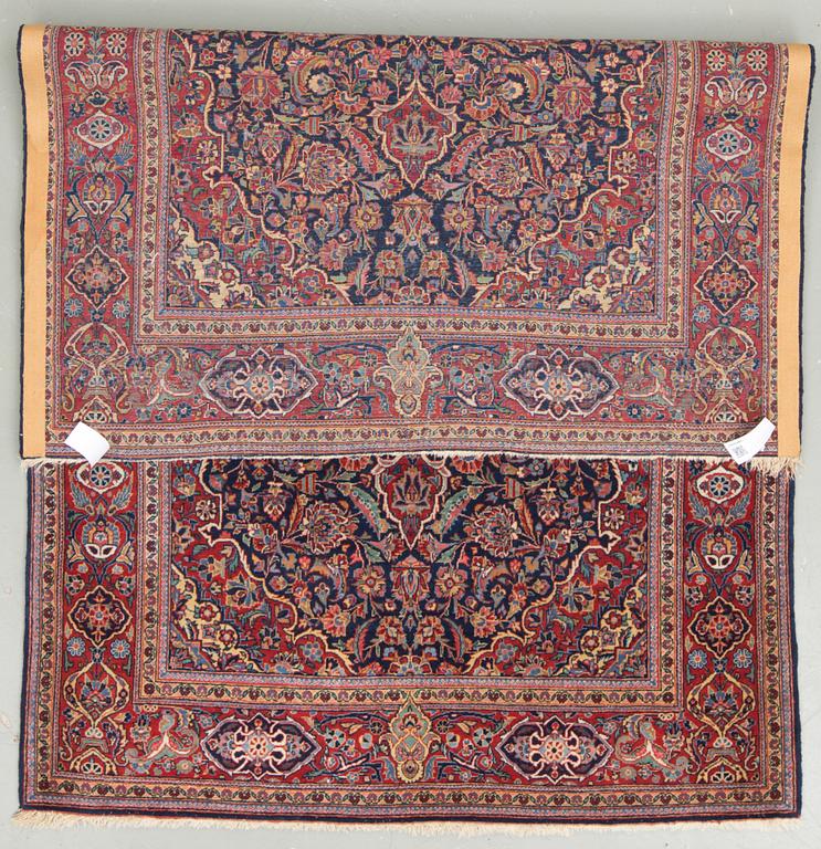 A semi-antique Kashan, around 209 x 130 cm.