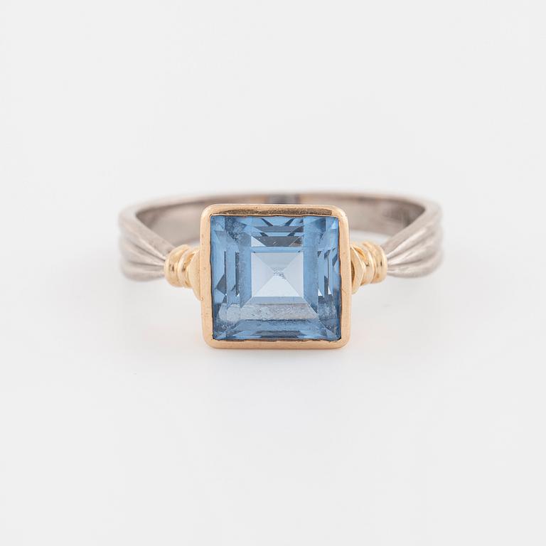 A synthetic blue spinel ring.