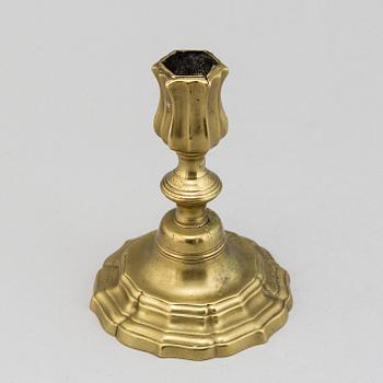 An 18th century rococo argent haché candlestick.