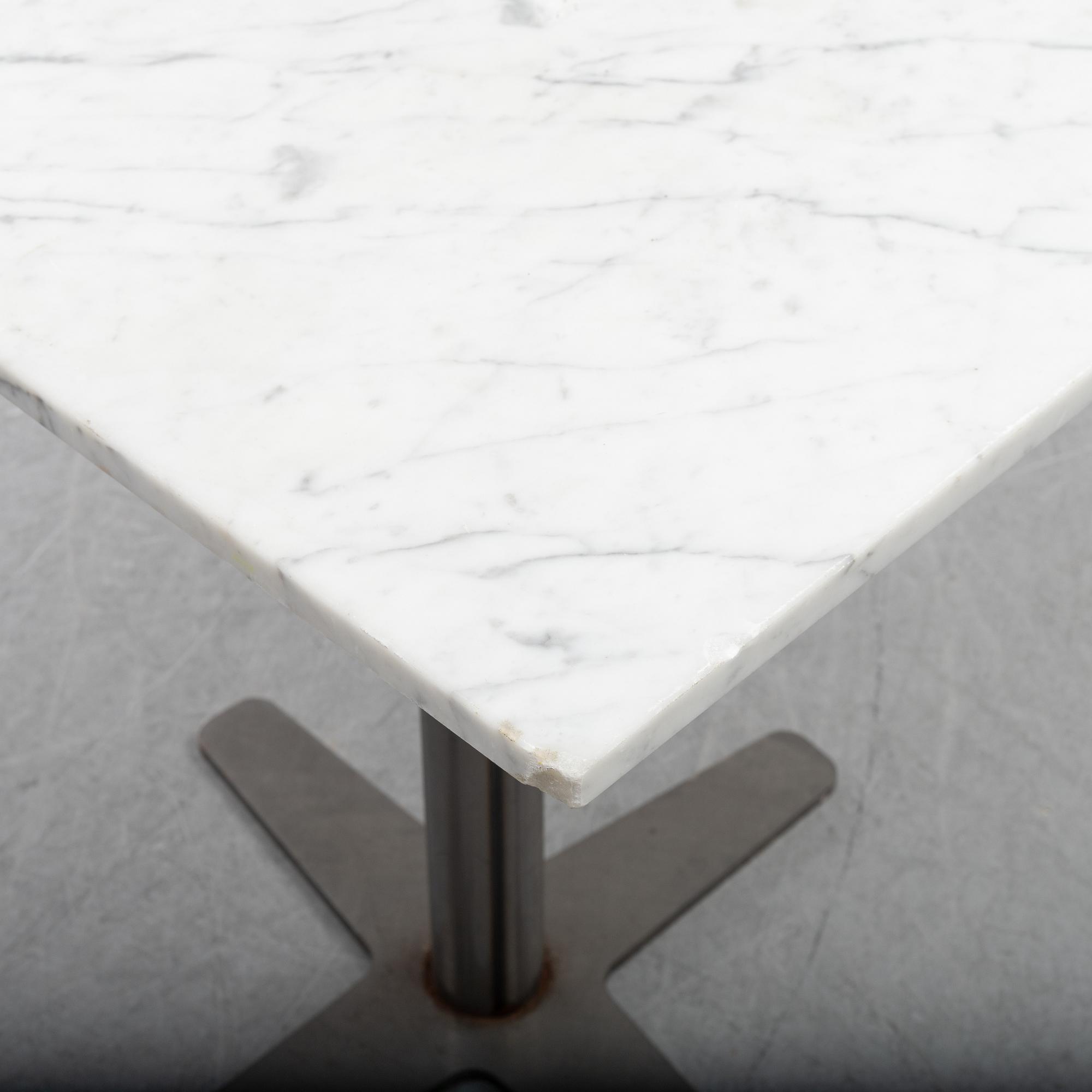 A marble top table, 21th century.