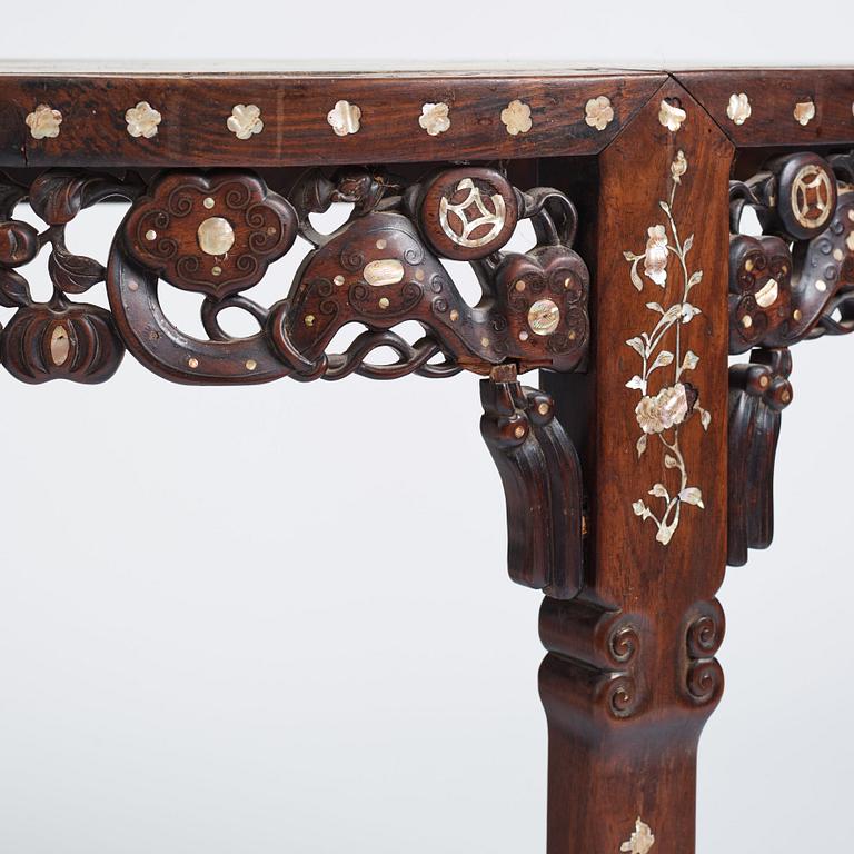 A Chinese hardwood demi-lune side table with mother-of-pearl inlays, late Qing dynasty.