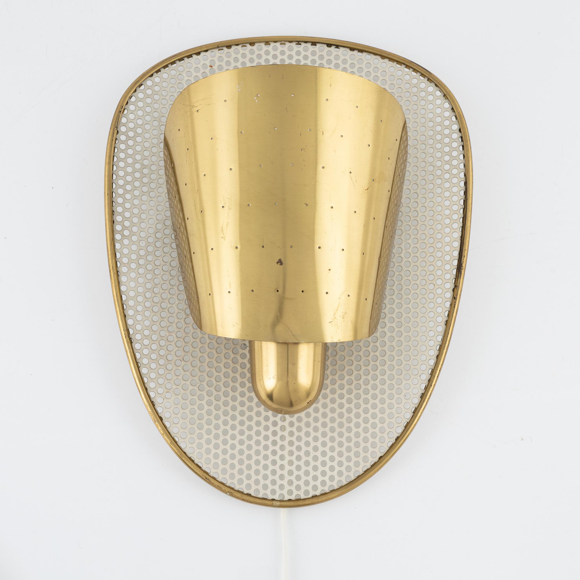 Swedish Modern, a brass wall lamp, 1940-50s.