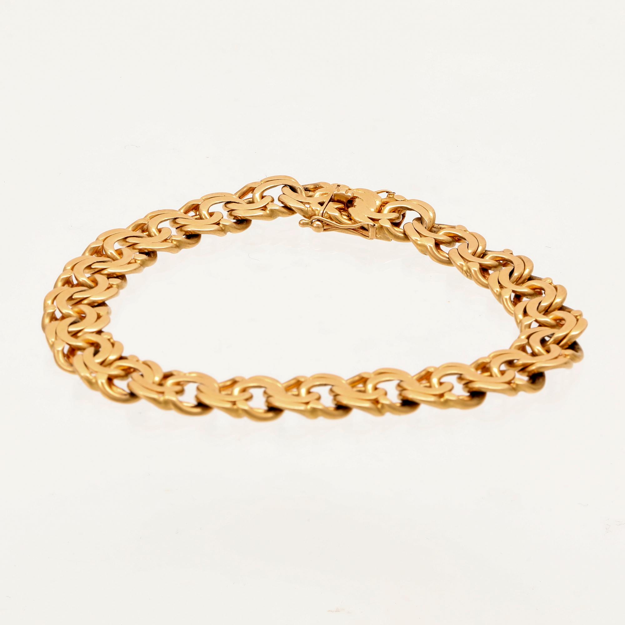 An 18K gold Bismarck bracelet.