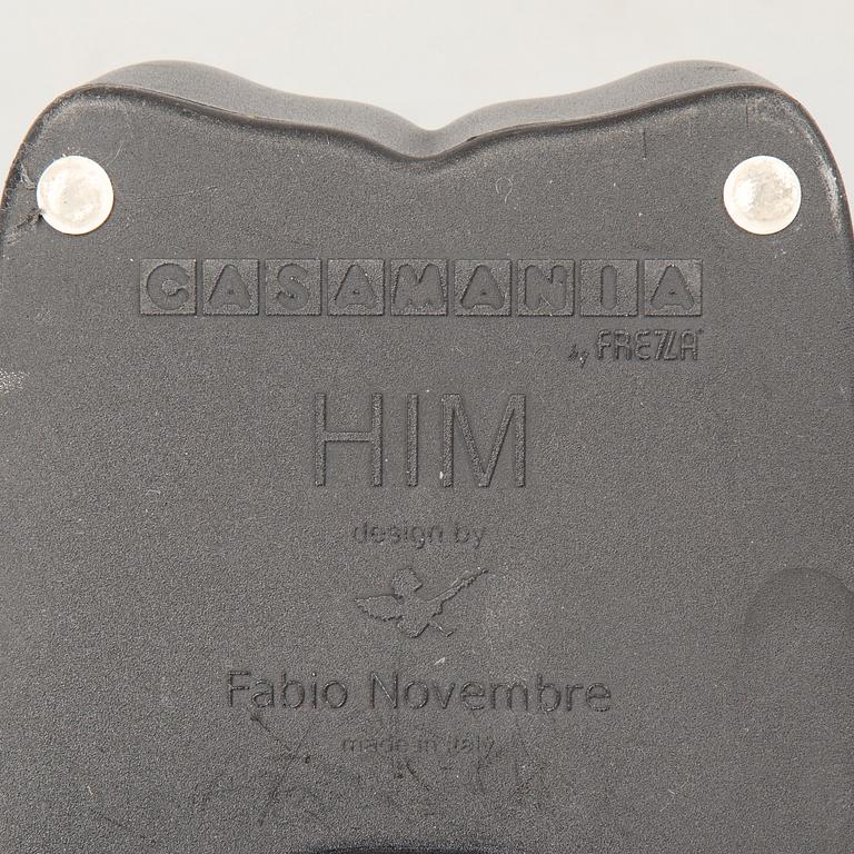 a pair of Italian black plastic chairs designed by Fabio Novembre "Him" and "Her" from the late 20th Century.