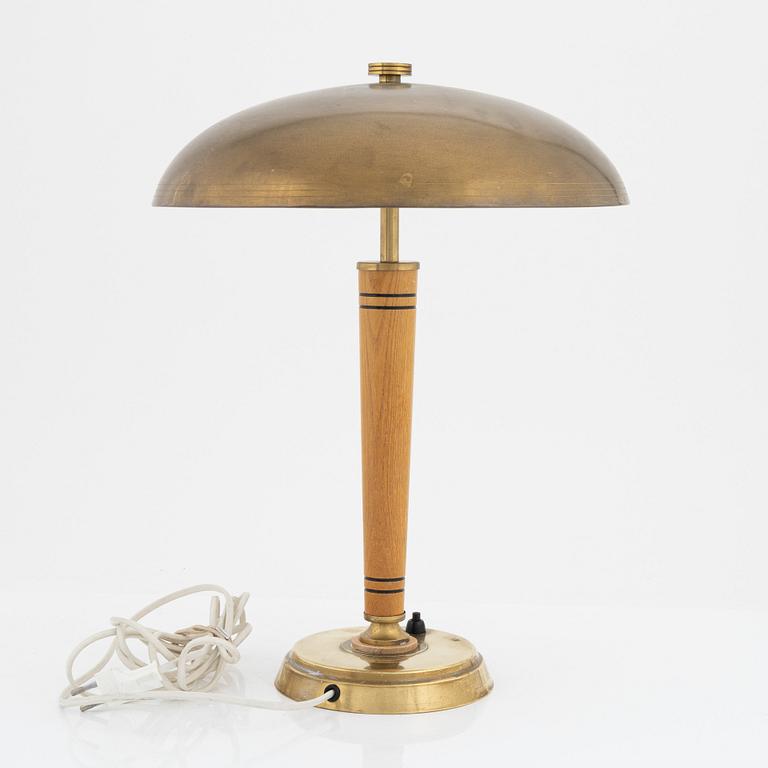 A Swedish Morden brass and elmwood table light, 1940's.