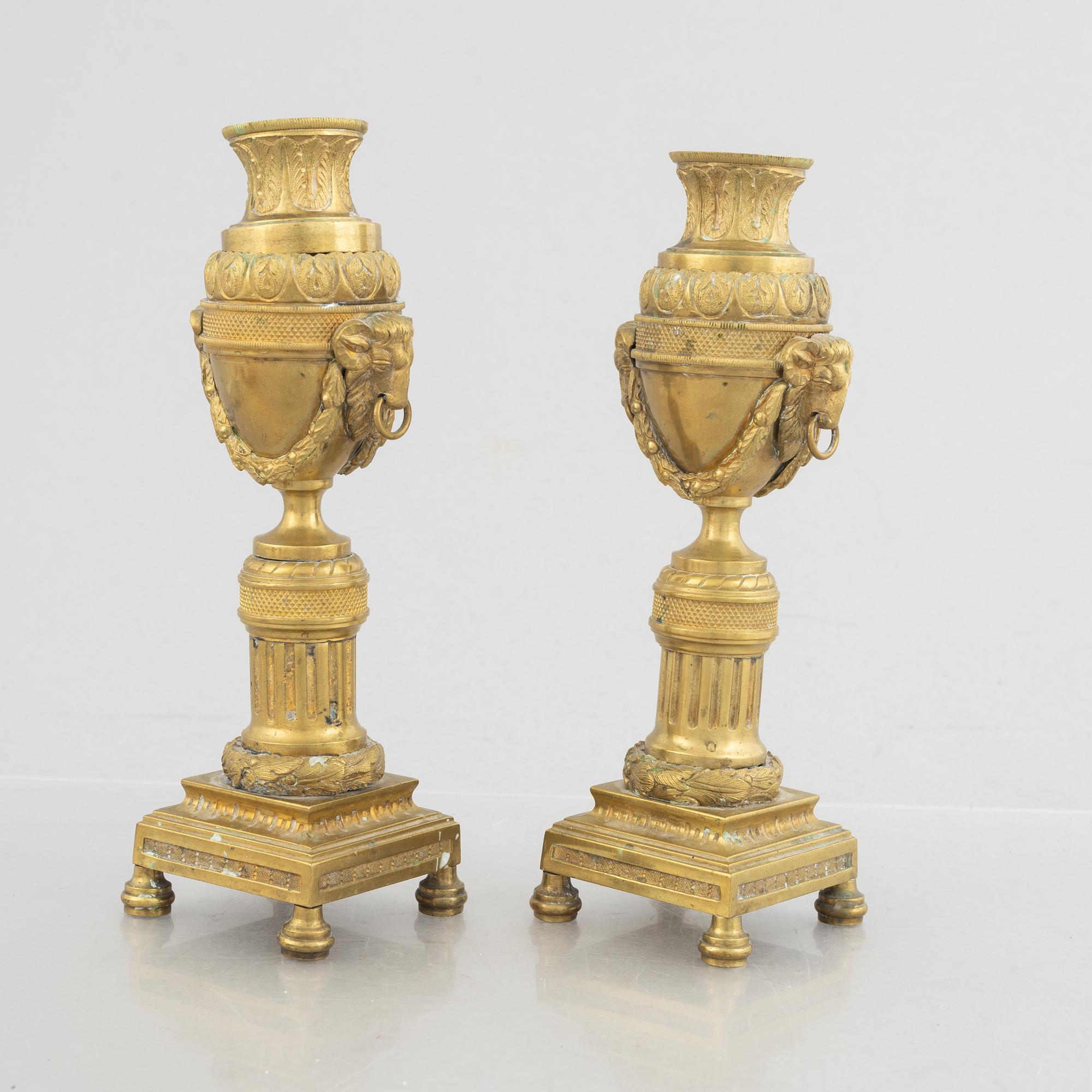 A pair of Louis XVI-style candlesticks, late 19th century.