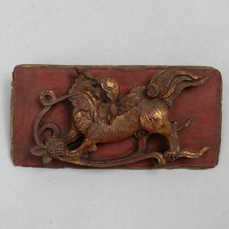 A group of three Chinese wooden panels, late Qing dynasty / around 1900.