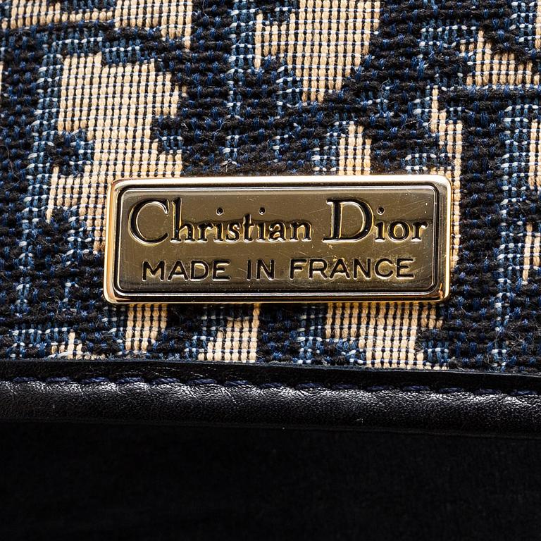 CHRISTIAN DIOR, a set of a clutch, a belt and an umbrella.
