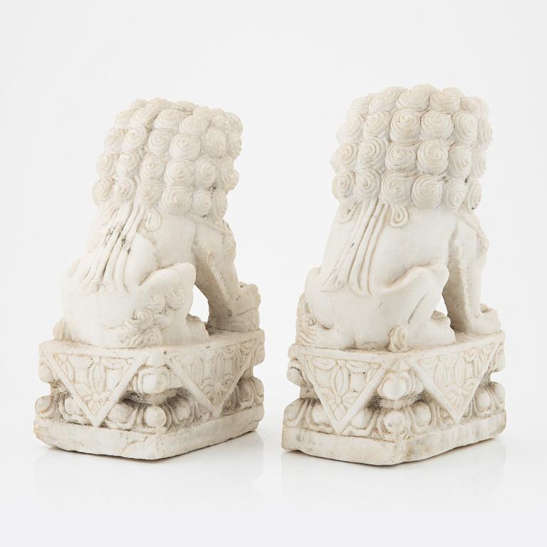 A pair of Chinese sculpture of buddhist lions, 20th Century.