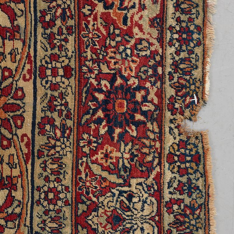 A carpet, an antique Kerman Laver, ca 677-688,5 x 510,5-526 cm.