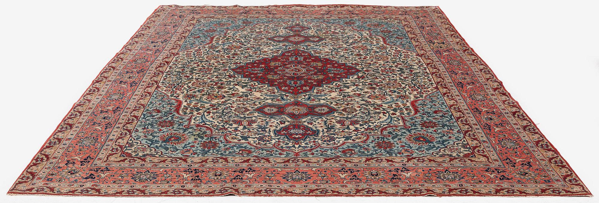 A semi-antique Qum carpet. Central Persia, c. 345 x 258 cm.