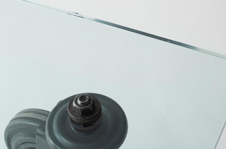 A Gae Aulenti 'Tavola con Ruote' table, Fontana Arte, Italy.