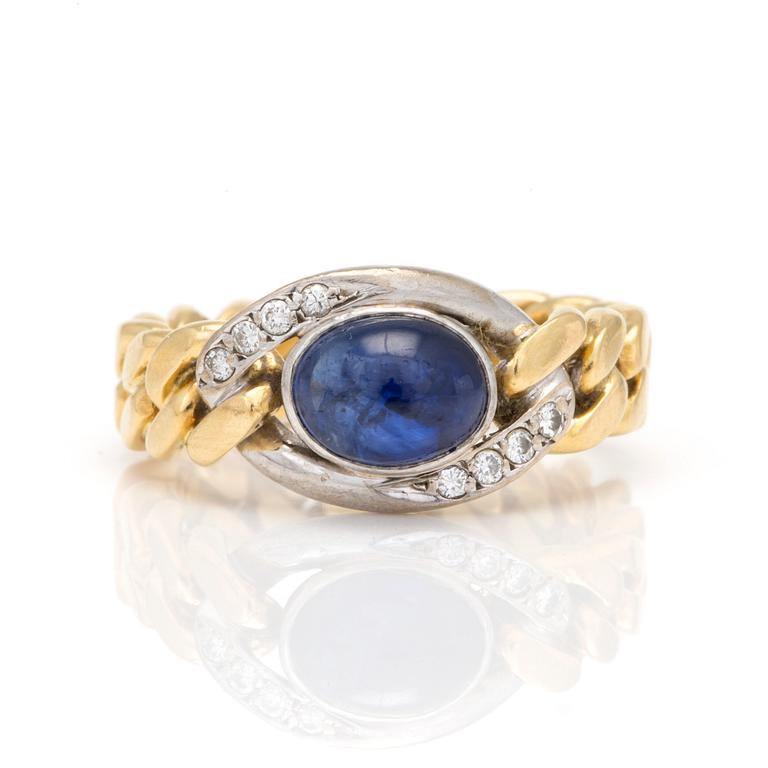 A ring with oval, cabochon-cut sapphire and eight-cut diamonds.