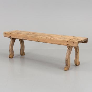 A 19th century folk art bench.