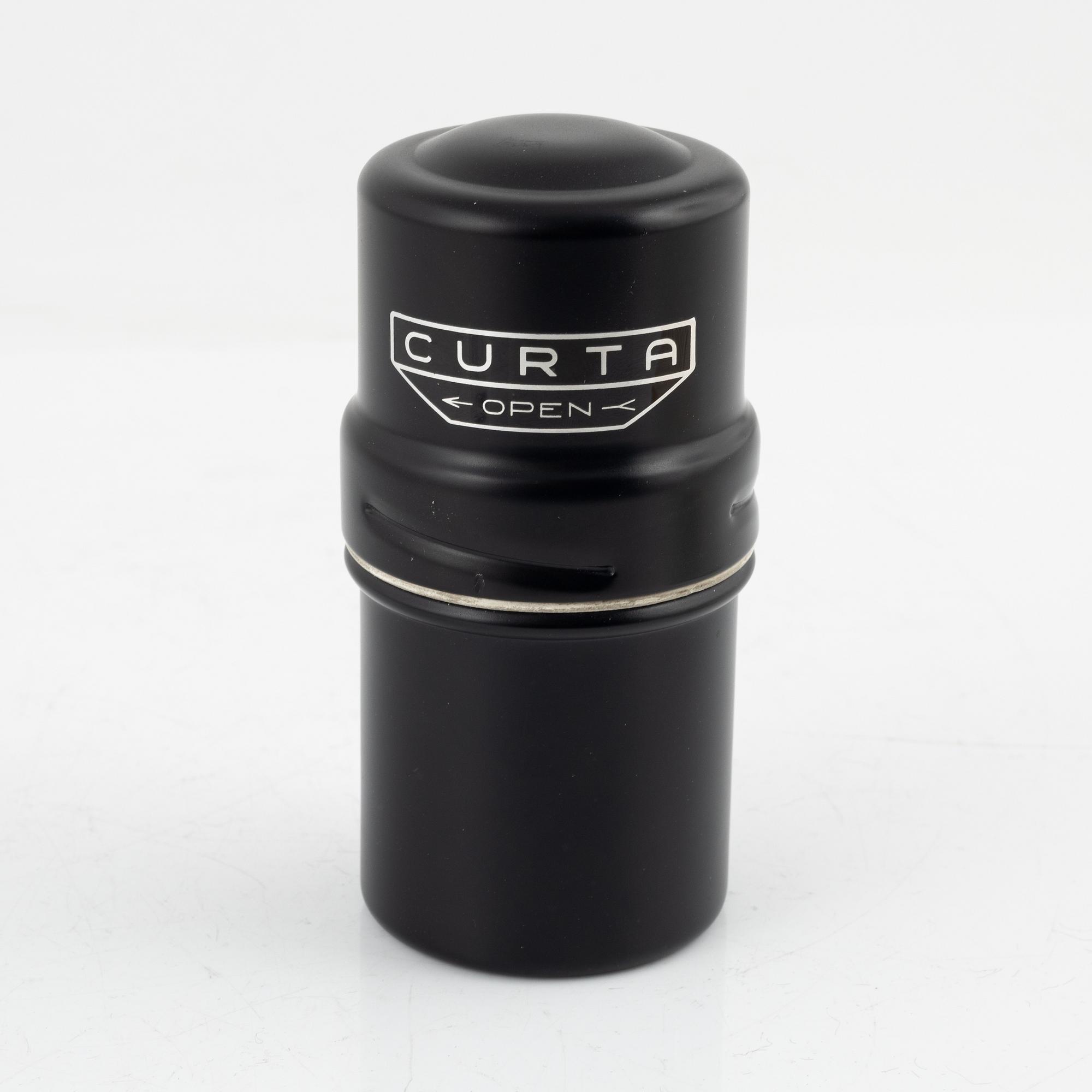 A Curta Type I mechanical calculator.