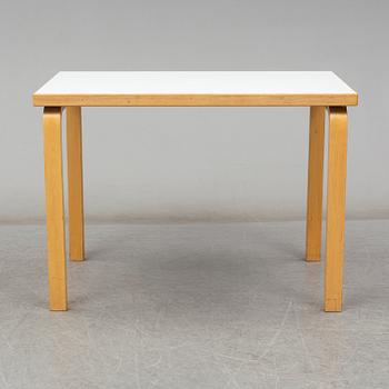 ALVAR AALTO, a table with four model 69 chairs, Artek.