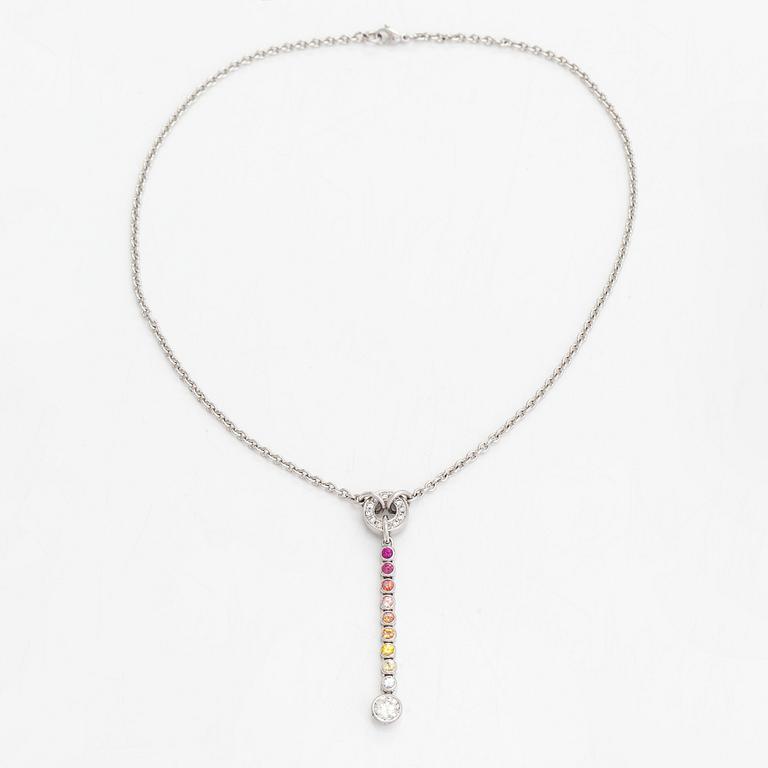 An 18K whitegold necklace with a diamond ca 1.01 ct, smaller diamonds tot. ca 0.15 ct, ruby and 
sapphires, Helsinki.