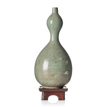 1178. A Korean Celadon glazed double gourd bottle, Koryo dynasty, 12/13th century.